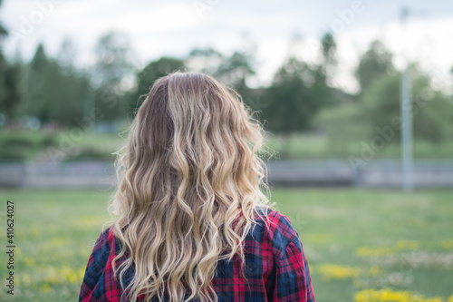 back view blonde woman head outside