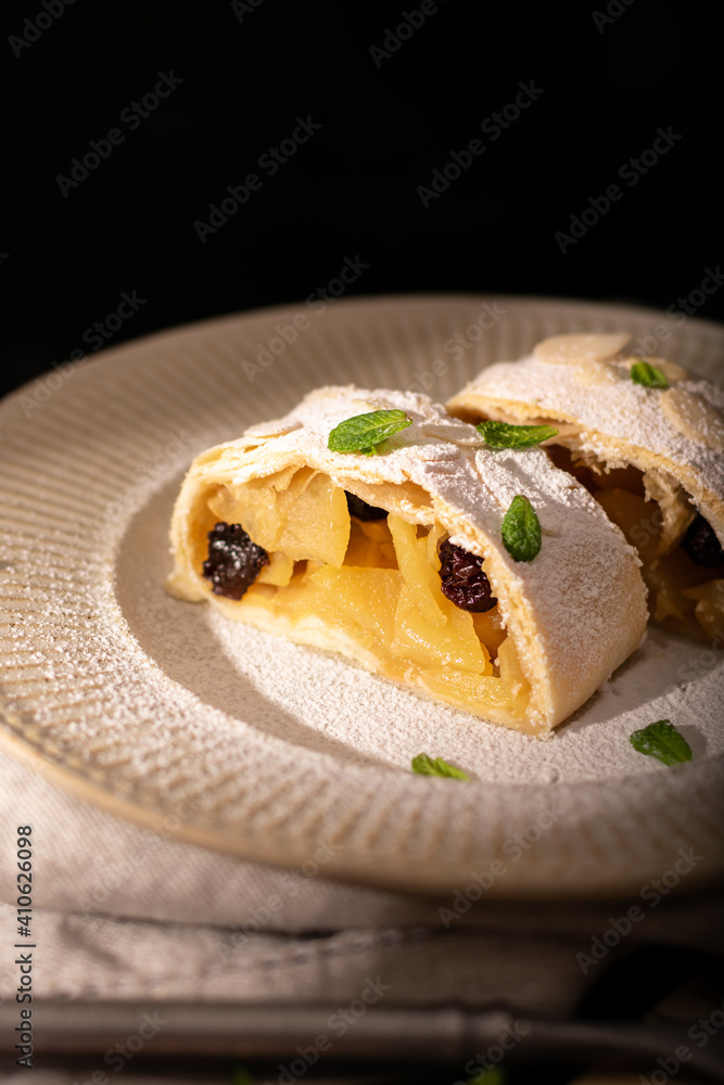 Close up of apple austrian strudel with cinnamon on a plate