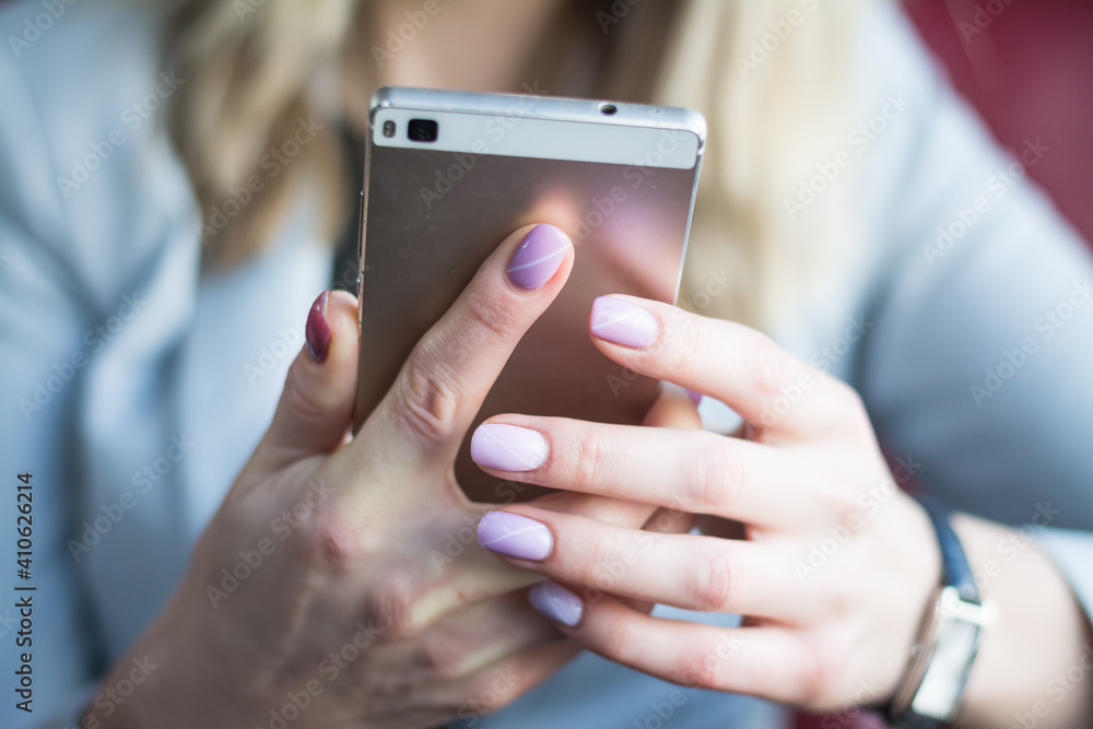 Close up of hands woman using cell phone