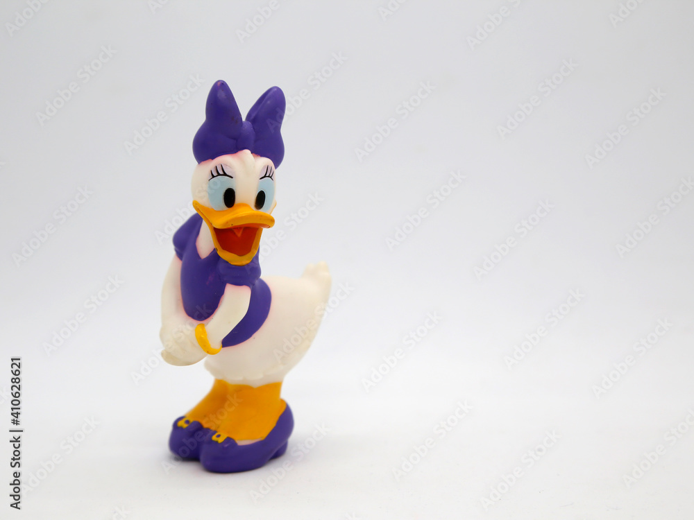 Daisy Duck. Toy. Cartoon characters from Walt Disney Pictures Studios.  Minnie is Mickey Mouse's girlfriend. Daisy is Donald Duck's girlfriend.  Stock Photo