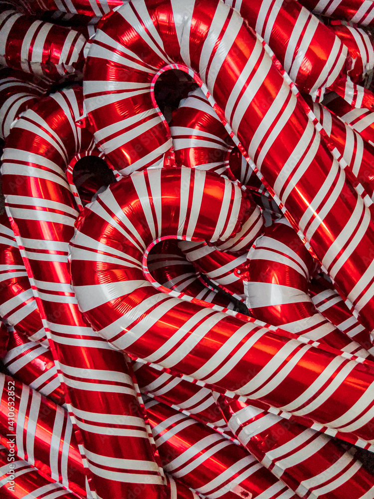 Festive Christmas candy cane balloons background