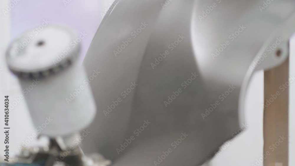 Modern paint booth for car painting, painter paints car details bumper, bodywork. Close up Modern paint booth for car painting, painter paints car details bumper, bodywork. Close up