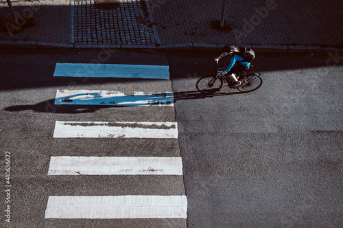 view from above on the person cycling streets of the city