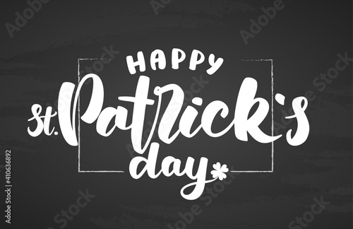 Vector Hand drawn lettering of Happy St. Patrick's Day on blackboard background.