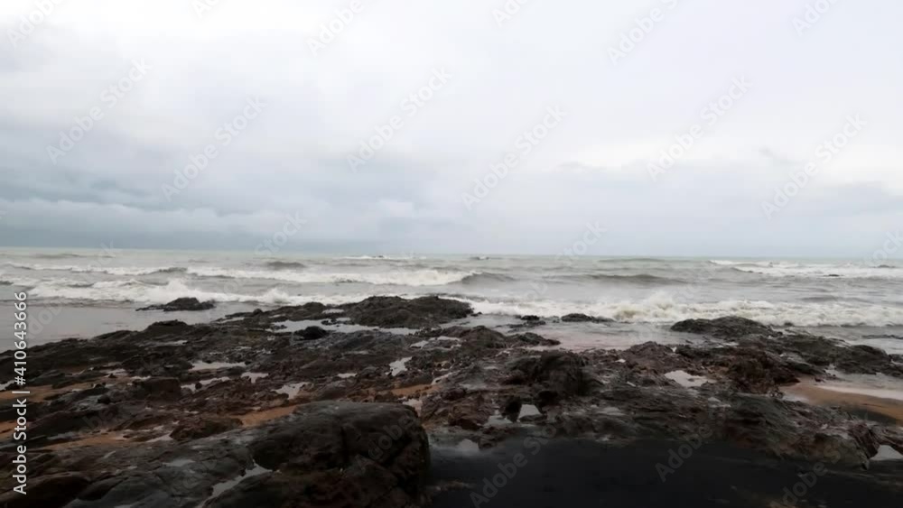 Storm sea water n rough ocean wave crashing Rock stone black beach coast in tropical summer bokeh sun light n sunbeam flare effect on white n gray cloudy sky, 4k cinemagraphs b-roll TimeLapse Storm sea water n rough ocean wave crashing Rock stone black beach coast in tropical summer bokeh sun light n sunbeam flare effect on white n gray cloudy sky, 4k cinemagraphs b-roll TimeLapse
