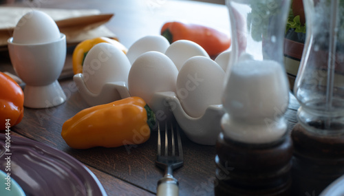 Eggs and sweet peppers on the table. Home kitchen. Soft focus on the background. Still life