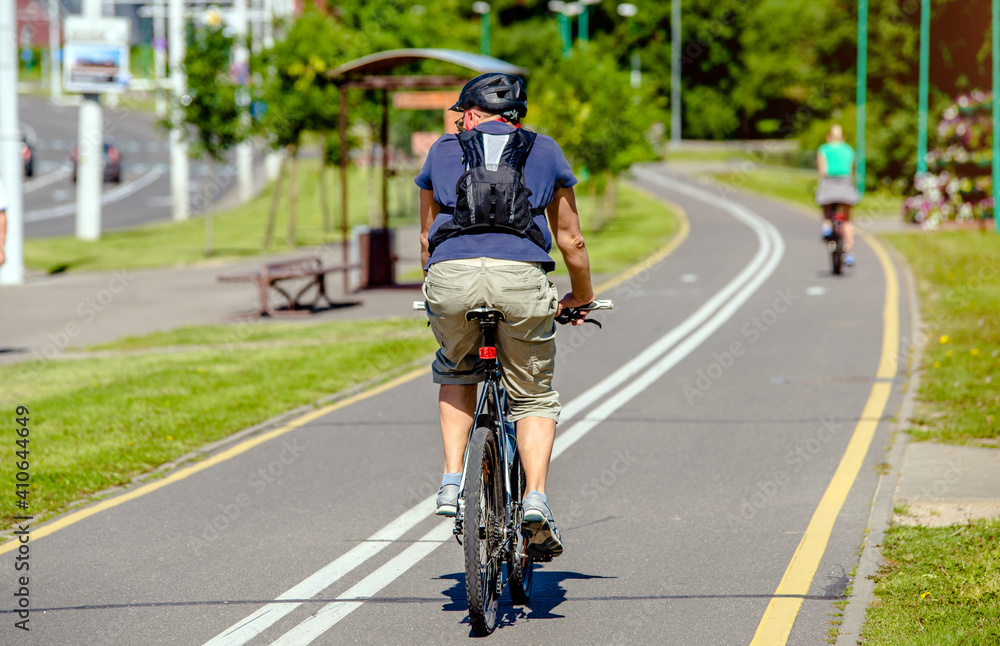 Cyclist ride on the bike path in the city Park
