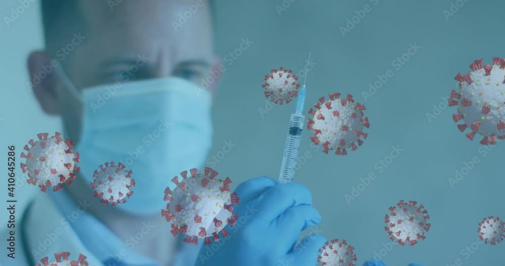 Animation of covid 19 cells and male doctor wearing mask preparing vaccine syringe Animation of covid 19 cells and male doctor wearing mask preparing vaccine syringe