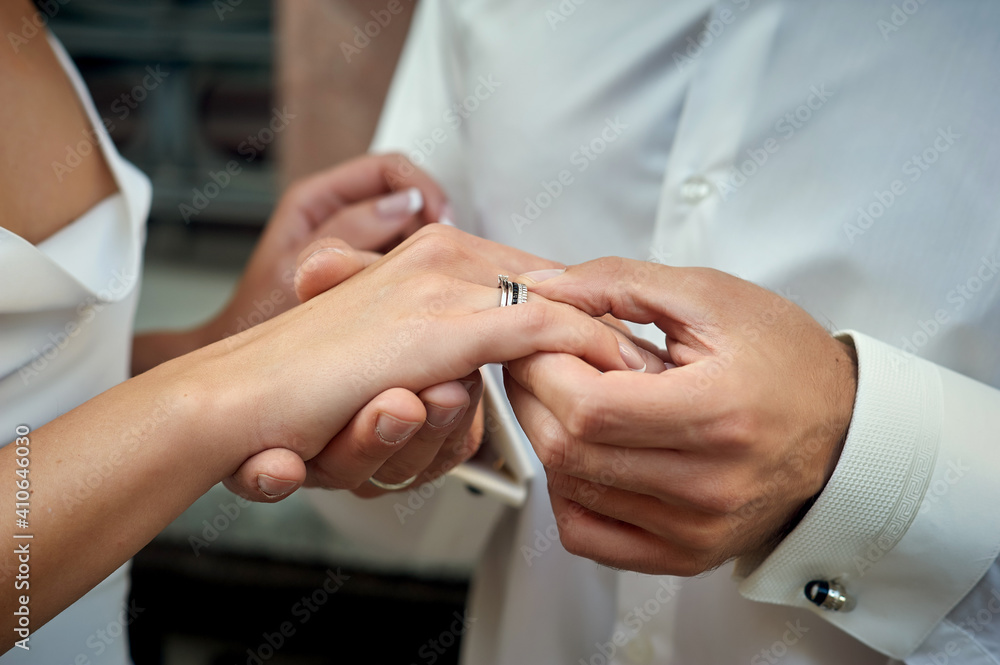 Close up of newlyweds hands on wedding day