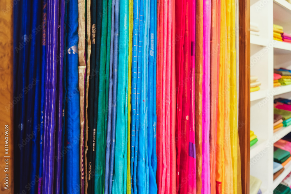 Heap of cloth fabrics at a fabric and sarongs store in India.