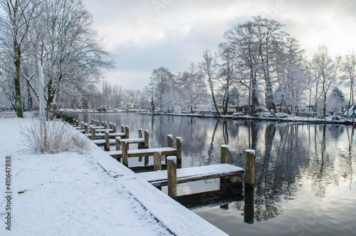 Wood dock at a lake in winter