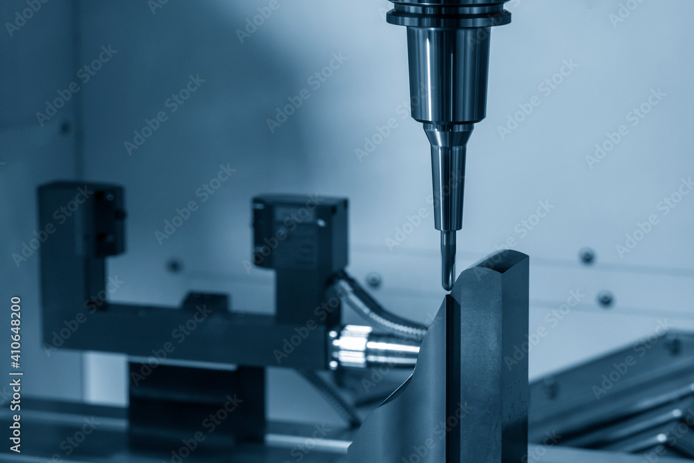 The CNC milling machine cutting the mold parts by solid ball end-mill tool. The hi-precision mold and die manufacturing concept by machining center. The CNC milling machine cutting the mold parts by solid ball end-mill tool. The hi-precision mold and die manufacturing concept by machining center.