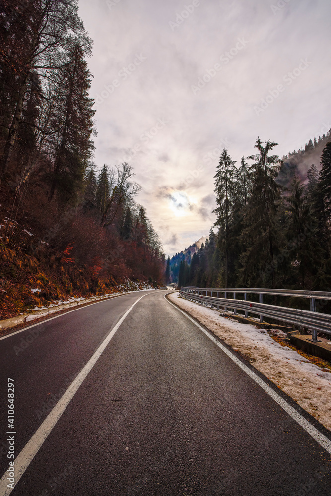 landscape with an empty mountain road in winter landscape with an empty mountain road in winter