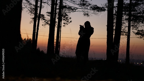 silhouette of a person in a forest