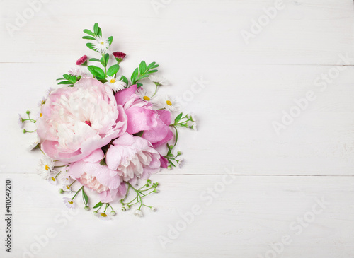 Bouquet of beautiful flowers on white wooden background. Top view. Copy space © msk.nina