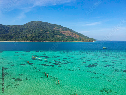 The aerial view of Koh Lipe island, Thailand. The paradise turquoise beach with the big mountain behind. 