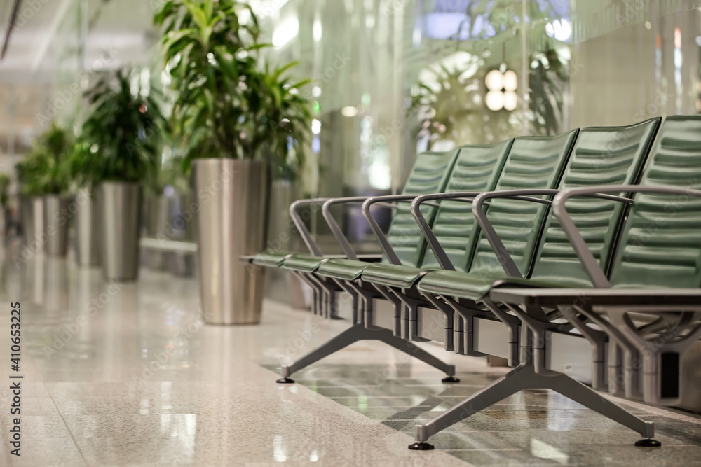 Fototapeta premium Empty seats in airport terminal interior. Departure area