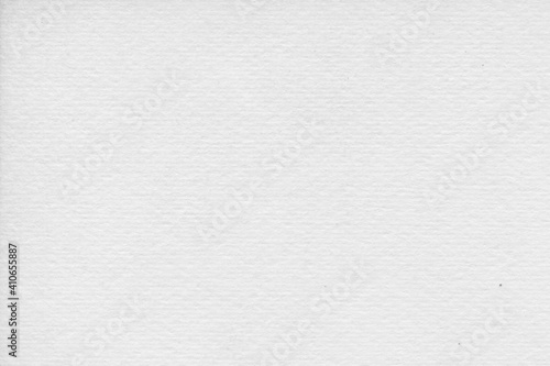 Cardboard gray texture close-up. Light old paper background. Grunge concrete wall. Vintage blank wallpaper.