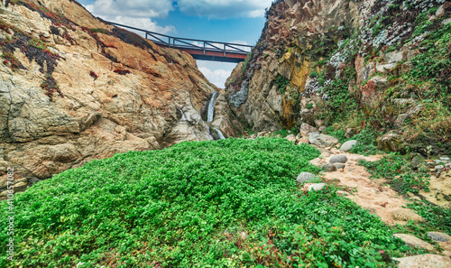 Beautiful landscape of a small waterfall in Garrapata State Park, on the hiking trails of Point Soberanes, California, USA photo