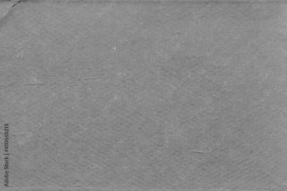 Fototapeta premium Cardboard gray texture close-up. Light old paper background. Grunge concrete wall. Vintage blank wallpaper.
