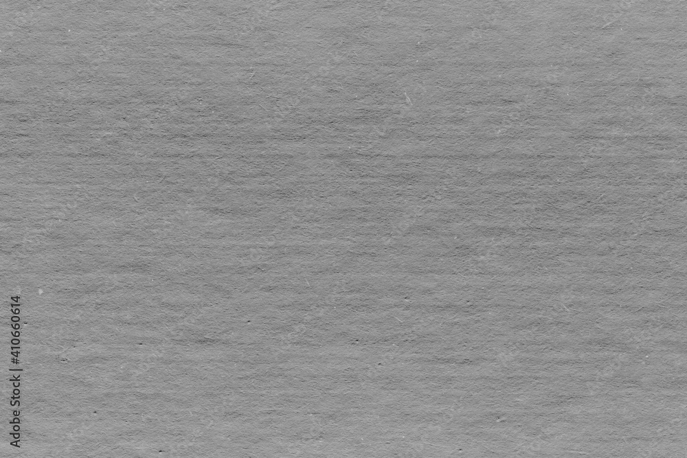 Cardboard gray texture close-up. Light old paper background. Grunge concrete wall. Vintage blank wallpaper. Cardboard gray texture close-up. Light old paper background. Grunge concrete wall. Vintage blank wallpaper.