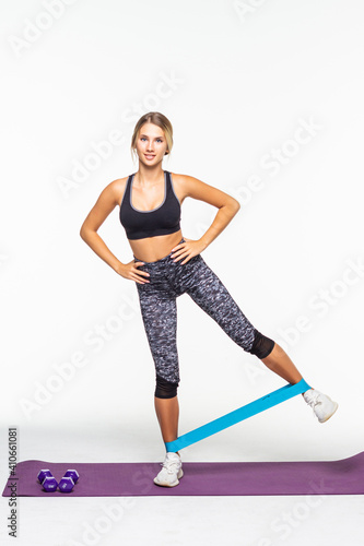 Wallpaper Mural Fitness woman exercising fitness resistance bands on mat isolated on white background Torontodigital.ca