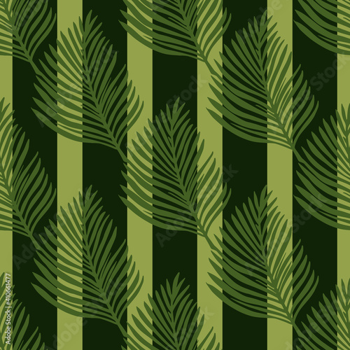Vintage botanic seamless pattern with green hand drawn fern leaf ornament. Black striped background.
