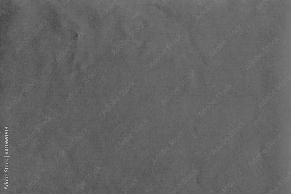Naklejka premium Cardboard gray texture close-up. Light old paper background. Grunge concrete wall. Vintage blank wallpaper.