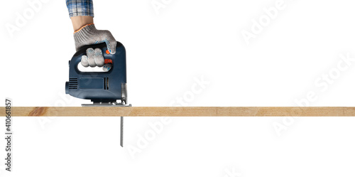 construction tool electrofret saw and sawed wooden board photo