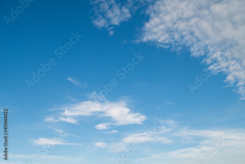 Natural clear blue sky with some clouds for background or backdrop freedom concept