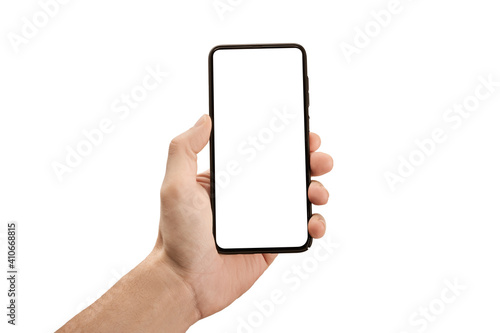 Man hand holding the black cell phone smartphone with blank white screen and modern frame less design - isolated on white background. Mockup mobile phone