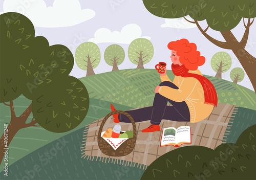 Picnic. Coffee outdoor. Woman drink tea and read book sitting on plaid on meadow or in the park. Spring mood.