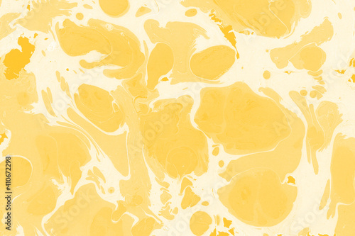 Yellow luxury marble ink texture on watercolor paper background. Marble stone image. Bath bomb effect. Psychedelic biomorphic art.