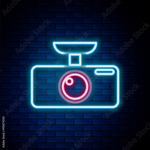 Glowing neon line Car DVR icon isolated on brick wall background. Car digital video recorder icon. Colorful outline concept. Vector.