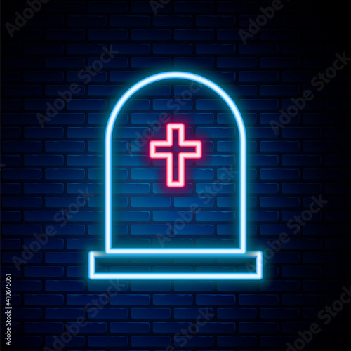 Glowing neon line Tombstone with cross icon isolated on brick wall background. Grave icon. Colorful outline concept. Vector.