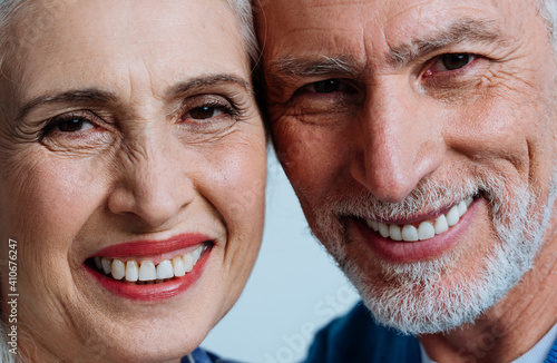 Happy senior couple posing in a studio for a photoshooting
