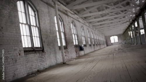 Wallpaper Mural Twirling shot across the long hall of an old abandoned 1900s industrial factory in the city Torontodigital.ca