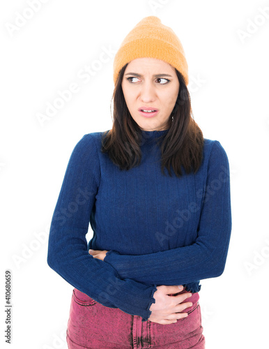 Young woman suffering from bellyache - stomachache, isolated on white background. Beautiful female person with chronic gastritis. Abdomen bloating concept