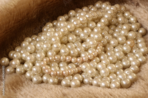 White pearls on fur background