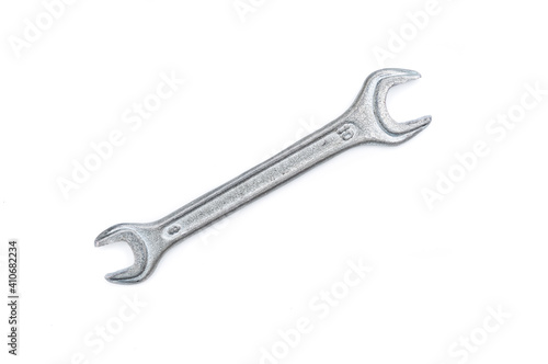Metal wrench close up isolated on white background