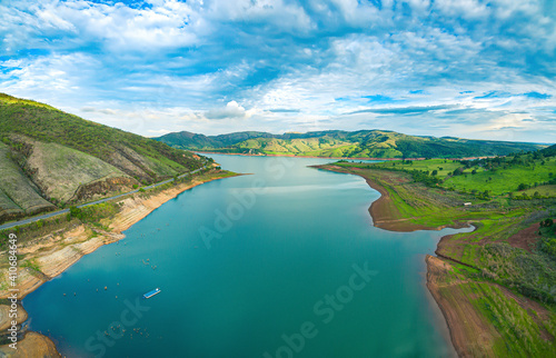 Aerial view at the Lake of Furnas at Capitólio - MG, Brazil. Beautiful landscape between mountains on a blue sky. Eco tourism destination of Minas Gerais state. photo