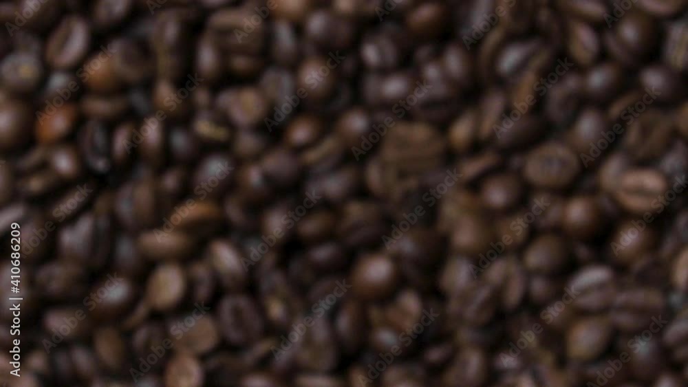 Close up of fragrant coffee beans are roasted smoke comes from coffee beans.
Close up of fragrant coffee beans are roasted smoke comes from coffee beans.