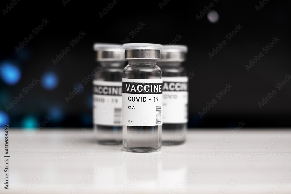 Three cans of coronavirus vaccine. against a black background. copy space, banner Three cans of coronavirus vaccine. against a black background. copy space, banner