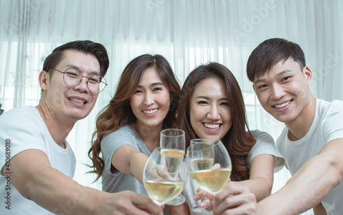 Wall Mural Asian people make a toast in the party at home