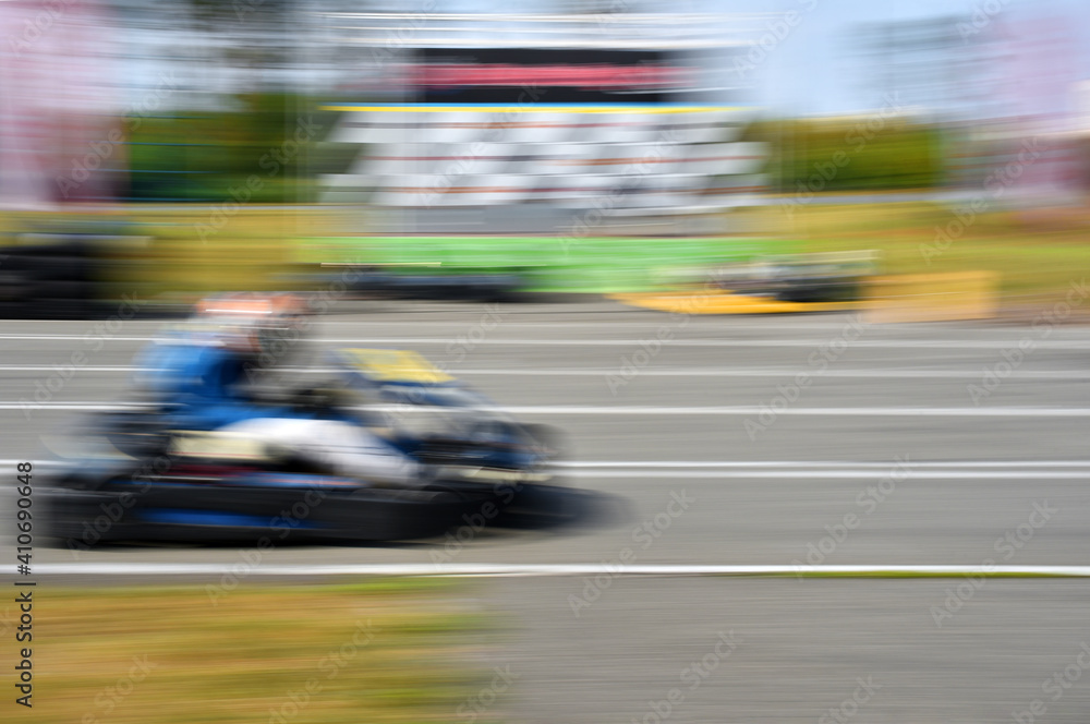 Kart racing or karting in high speed motion blur