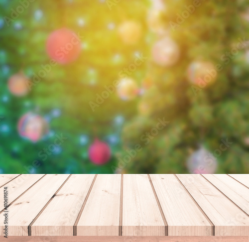 wood plank with abstract blurred background of Christmas tree for product display