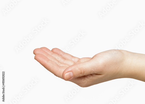 Female caucasian hand slightly bent the palm on a white background isolate. health and beauty concept
