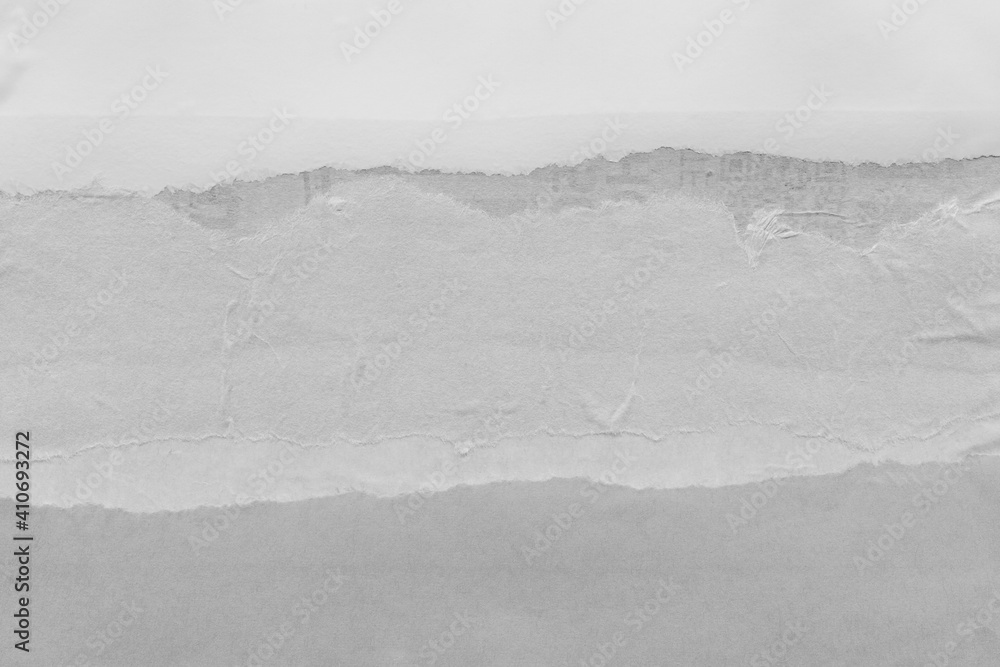 White torn paper collage close-up. Texture made from various paper and cardboard parts. Damaged old paper background. Vintage blank wallpaper. Material design backdrop. White torn paper collage close-up. Texture made from various paper and cardboard parts. Damaged old paper background. Vintage blank wallpaper. Material design backdrop.