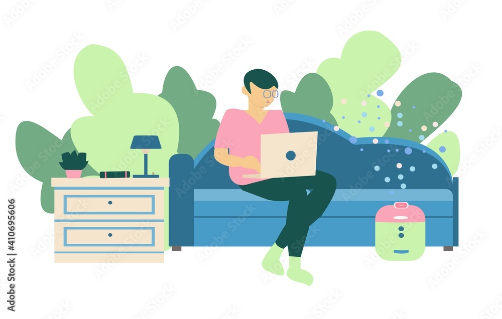 Freelancer working at home Young men seat on sofa with notebook and humidifier on nightstand