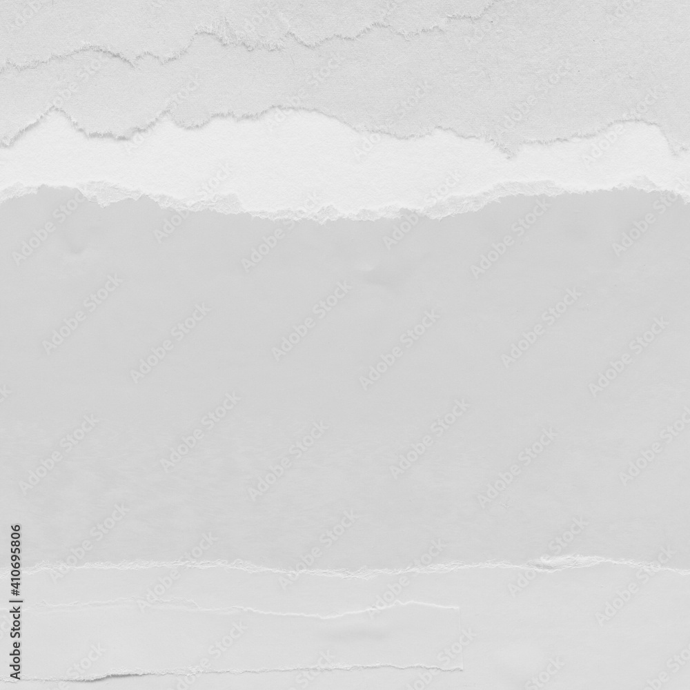Obraz premium White torn paper collage close-up. Texture made from various paper and cardboard parts. Damaged old paper background. Vintage blank wallpaper. Material design backdrop.